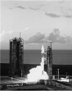 Delta rocket launching from pad carrying a DirecTV satellite.