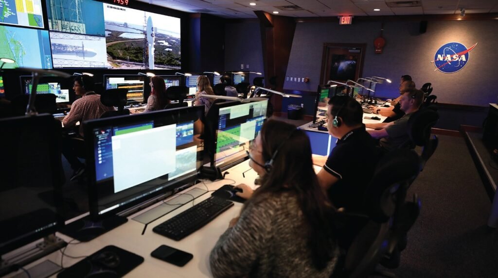 Launch Operators in the Mission Director Center looking at computer monitors